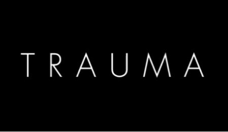 Image: A black rectangle with the word “TRAUMA” written in white text.